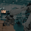 An industrial robotic arm stacking boxes in a warehouse, overlaid with a pixel-art robot icon, illustrating the integration of Structured Technical Tools in the robotics intelligence layer.