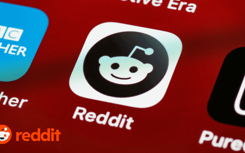 Close-up of the Reddit app icon on a smartphone screen, representing a marketing strategy for boosting SaaS visibility with Reddit upvotes and discussions.