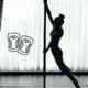 Silhouette of a dancer on a pole with an icon of protective gear, illustrating why it’s so important to buy high-quality knee pads for pole dancing.