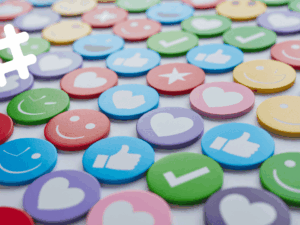 A collection of colorful circular social media icons featuring likes, hearts, and smiley faces, illustrating top-downloaded social media PNG icons and brand guideline usage.