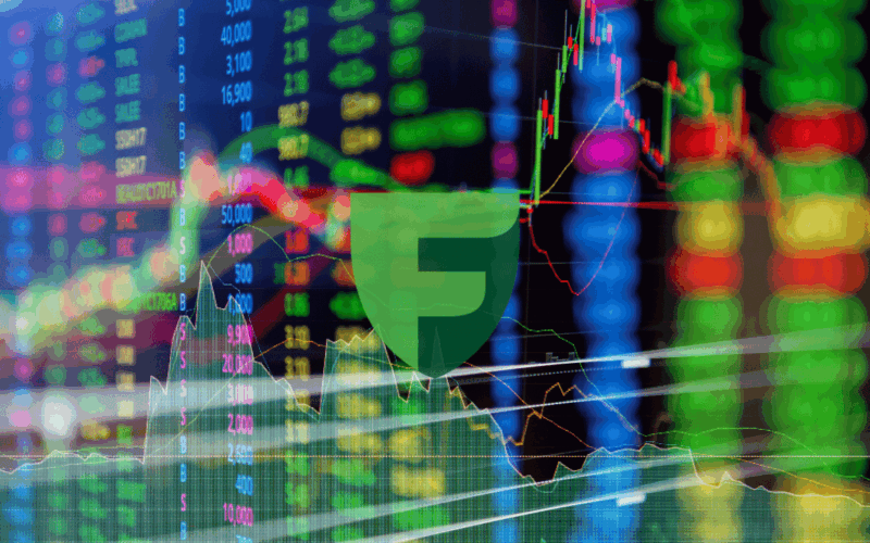 A 3D-style professional illustration of a businessman at a desk with a laptop, representing 10 facts about Timur Turlov, the CEO of Freedom Holding Corp.