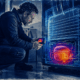 Appliance technician uses a thermal camera to detect an overheating refrigerator compressor through an AI assisted diagnostic view.