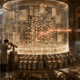 Infrastructure engineer inspecting a private RAG knowledge vault where documents and vector search stay local while selected context routes to AI generation.